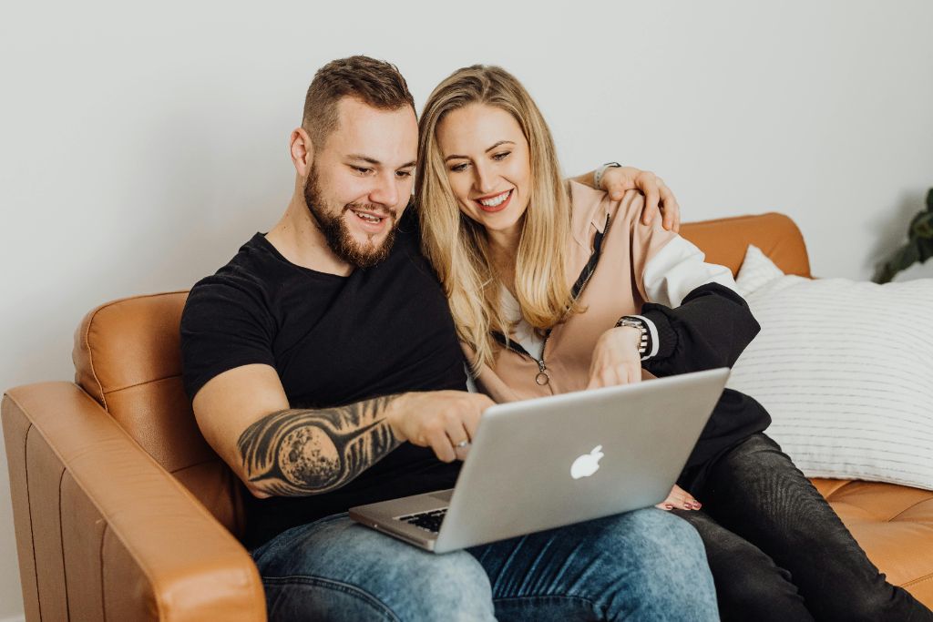 Happy couple reviewing their financial plan together